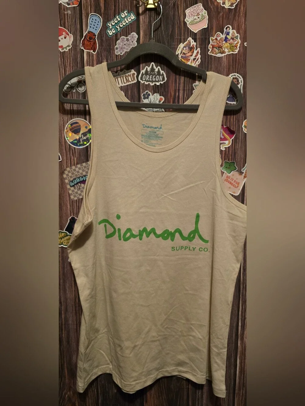 Diamond Supply Co. Cream Tank Top with Green Logo and back hit.